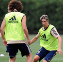 Fernando Torres and David Luiz run a drill