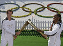 Andy Murray and Venus Williams exchange the flame
