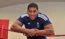 Anthony Joshua poses in the ring
