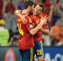 Xabi Alonso celebrates after scoring his second goal of the match with Santi Cazorla