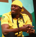 Usain Bolt shares a joke on stage