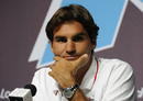 Roger Federer talks to the media