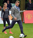 David Beckham steps up to kick the ball during US First Lady Michelle Obama's 'Let's Move-London' event