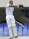 Kieran Powell celebrates after reaching his maiden Test century