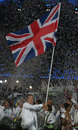 An emotional Sir Chris Hoy carries the British flag