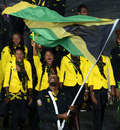Usain Bolt waves the Jamaican flag