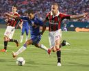 Eden Hazard is challenged by Ignazio Abate