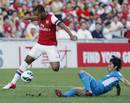 Theo Walcott evades a tackle