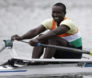 Niger's Hamadou Djibo Issaka smiles after his single sculls race