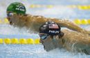 Michael Phelps and Chad le Clos compete in the men's 200m butterfly final 