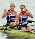 Heather Stanning and Helen Glover show off their gold medals