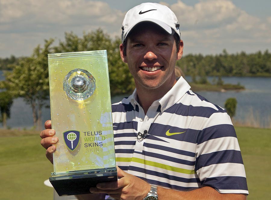 Paul Casey displays the trophy after winning the Telus World Skins Game golf match