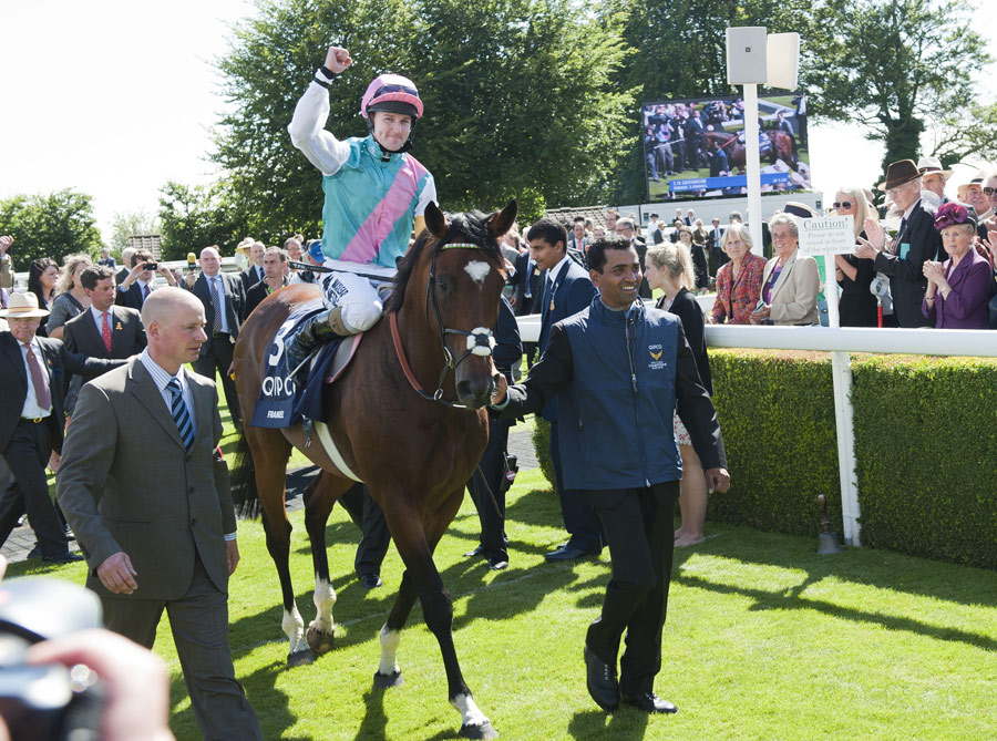 Tom Queally celebrates the win of Frankel in the Sussex Stakes