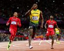 Usain Bolt celebrates winning gold