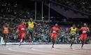 Usain Bolt crosses the line to win the men's 100m final
