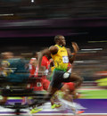Usain Bolt sprints away from the field