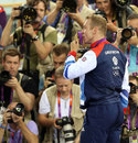 Sir Chris Hoy poses for photos with his gold medal