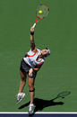 Alisa Kleybanova stretches through a serve