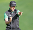 Englishman Ross Fisher lines up a putt