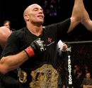 Georges St-Pierre has his hand raised
