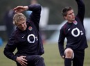 Lewis Moody and Toby Flood stretch during a training session