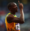Usain Bolt looks to the sky after his semi-final win