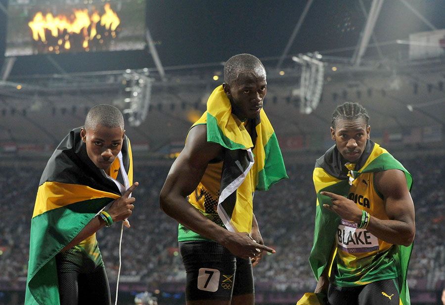 Warren Weir, Usain Bolt and Yohan Blake celebrate a clean sweep in the men's 200m
