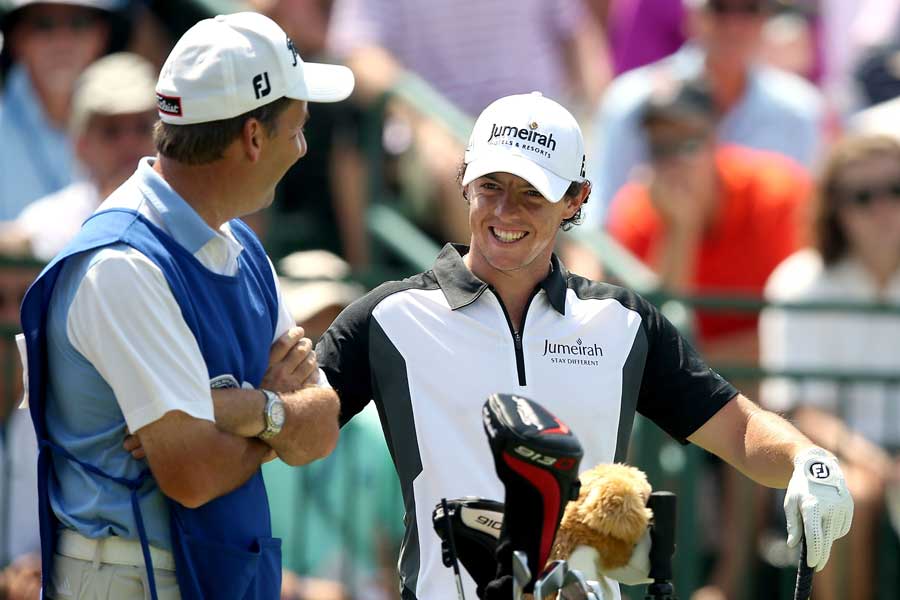 Rory McIlroy talks to his caddie