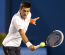 Novak Djokovic stretches for a backhand