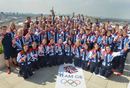 Great Britain's medal winners pose on the roof of Team GB House in Stratford