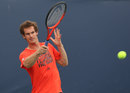 Andy Murray hits a forehand during a training session