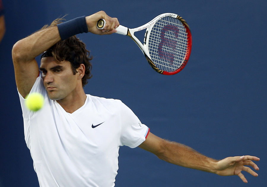 Roger Federer hits a forehand