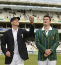 Graeme Smith looks on as Andrew Strauss performs the toss