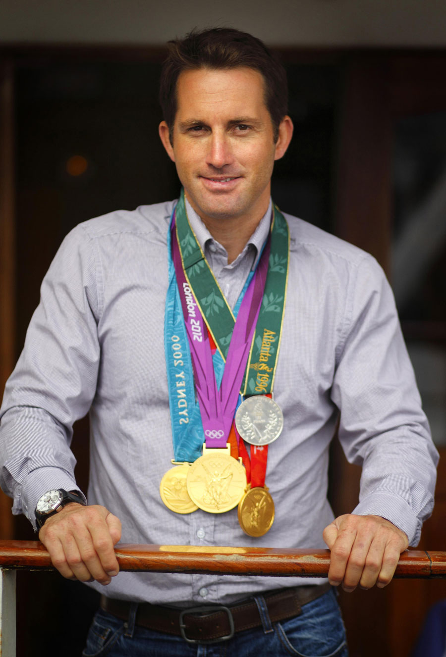 Ben Ainslie shows off his Olympic medals