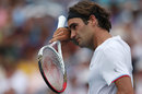 Roger Federer wipes sweat from his forehead