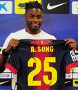 Alex Song poses for the cameras at a press conference