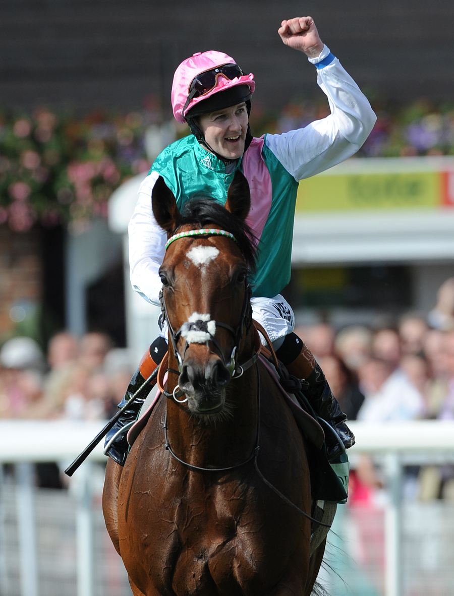 Tom Queally celebrates another Frankel win