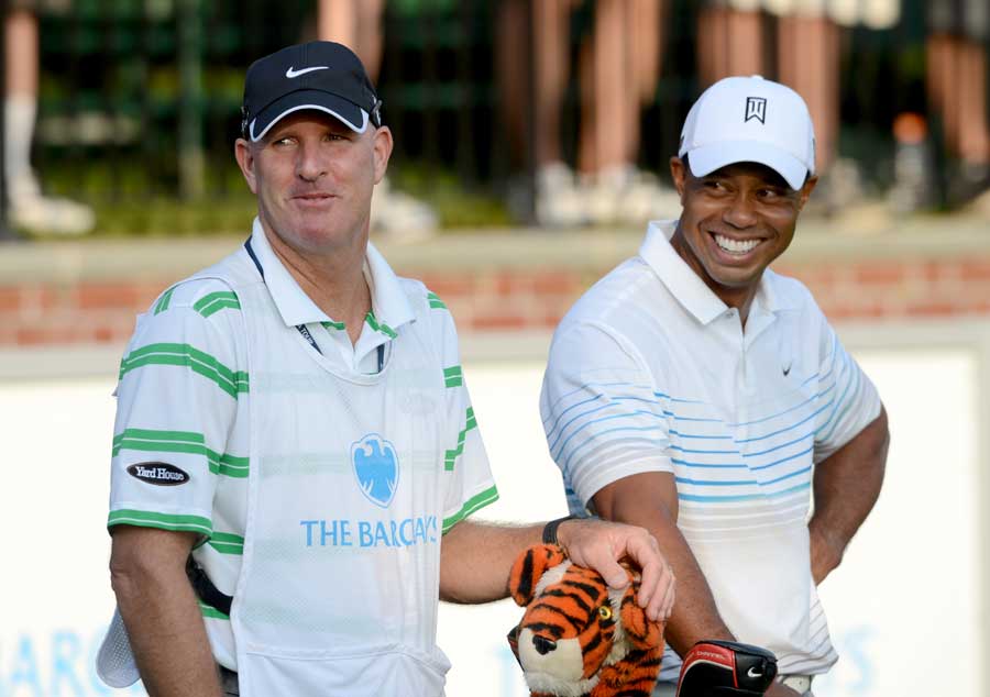 Tiger Woods smiles during practice