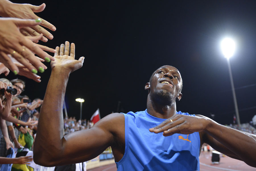 Usain Bolt celebrates his victory with his fans