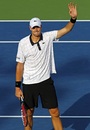 John Isner waves to the crowd after his victory