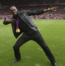Usain Bolt pulls off his signature pose