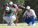 Nick Watney and Sergio Garcia assess the green