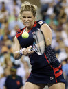 Kim Clijsters powers into a backhand