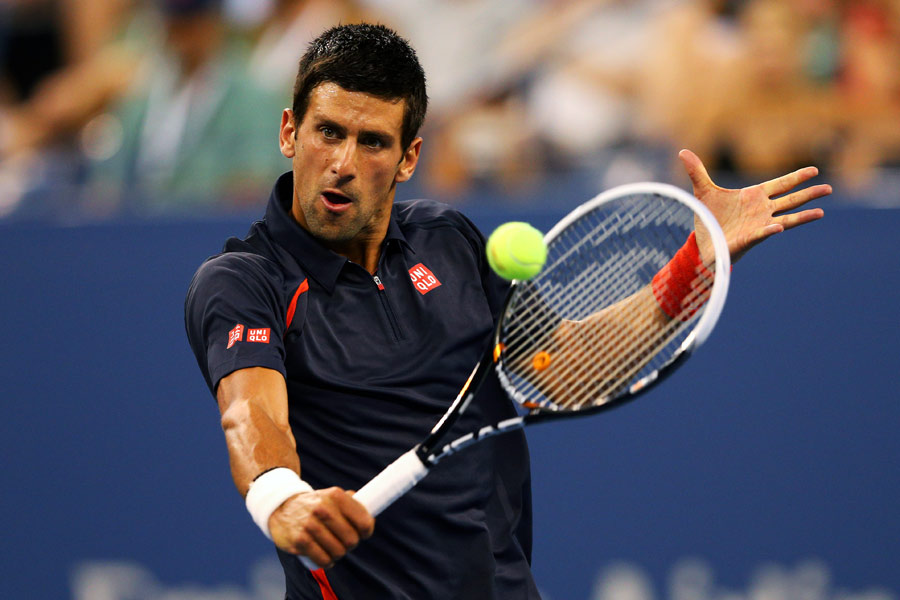 Novak Djokovic sets himself for a volley