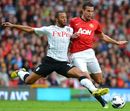 Moussa Dembele challenges Robin van Persie for the ball