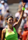 Victoria Azarenka gives a victory salute
