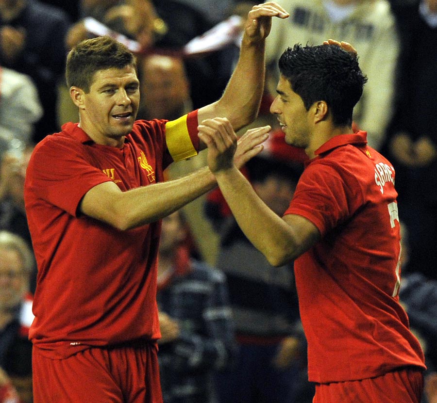 Luis Suarez is congratulated by Steven Gerrard after scoring