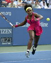 Serena Williams scampers for a forehand