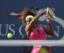 Serena Williams hits through a forehand