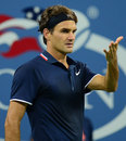 Roger Federer questions a line call
